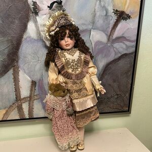 Collectors Large Porcelain Doll with Intricate Details and Adorable Teddy Bear